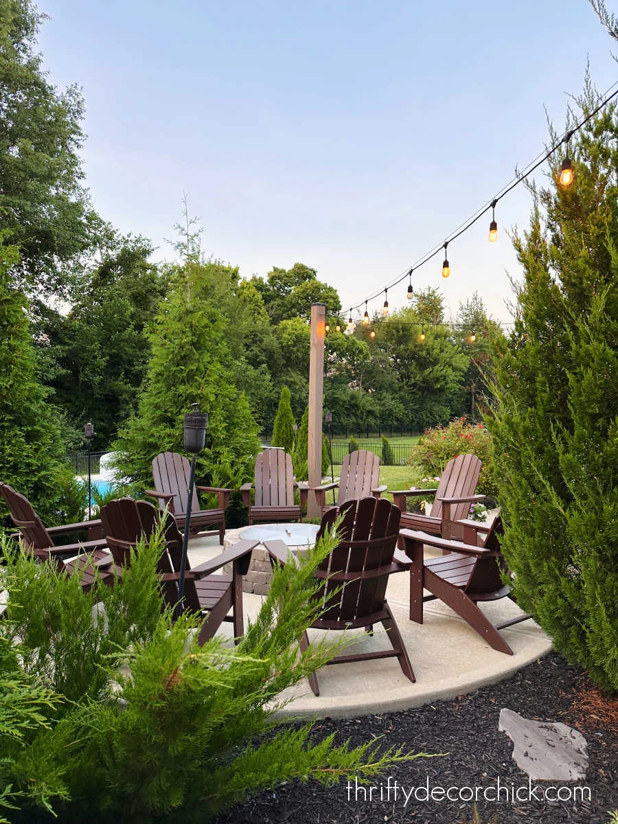 Adirondack chairs fire pit and lights
